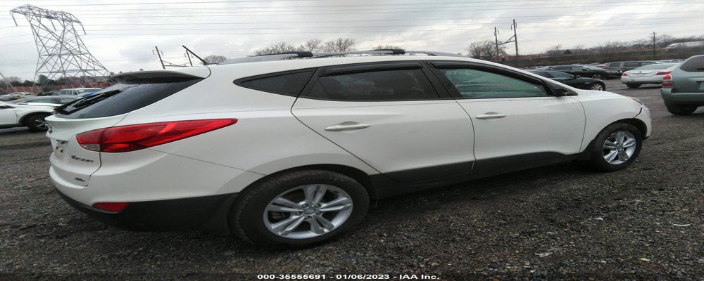 KM8JUCAC9DU667601 2013 HYUNDAI TUCSON photo no. 4