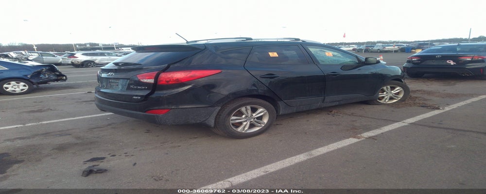 KM8JUCAC7DU611107 2013 HYUNDAI TUCSON photo no. 4