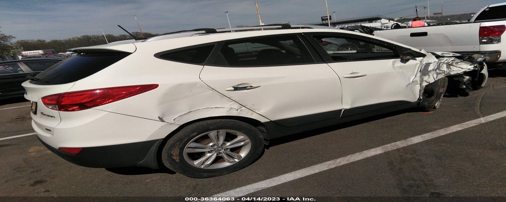 KM8JUCAC2CU493532 2012 HYUNDAI TUCSON photo no. 4