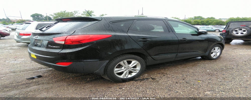 KM8JU3AC8DU715041 2013 HYUNDAI TUCSON photo no. 4