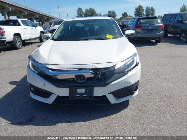 Auction sale of the 2016 Honda Civic Touring, vin: 2HGFC1F92GH102761, lot number: 40022417