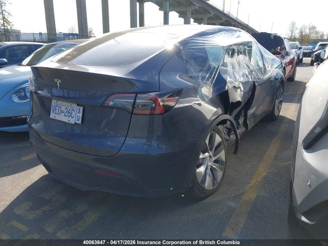 40063647 :رقم المزاد ، LRWYGDFDXPC164054 vin ، 2023 Tesla Model Y مزاد بيع