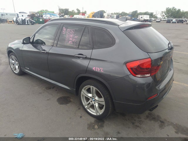 2014 BMW X1, VIN: WBAVM5C54EVV92671