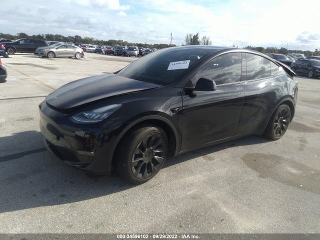 2021 Tesla Model Y, VIN: 5YJYGDED6MF116134