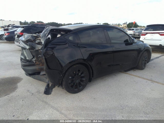 2021 Tesla Model Y, VIN: 5YJYGDED6MF116134