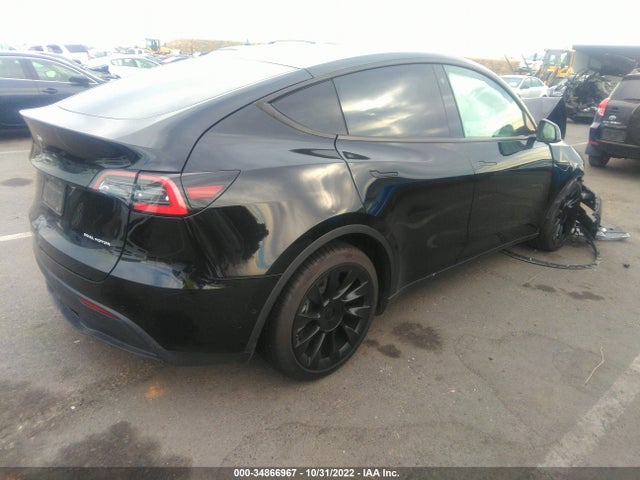 Tesla Model Y 2021 5YJYGAEE4MF138480 Image 4