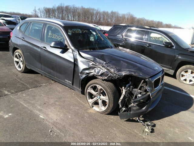 2014 BMW X1, VIN: WBAVM5C50EVV93302