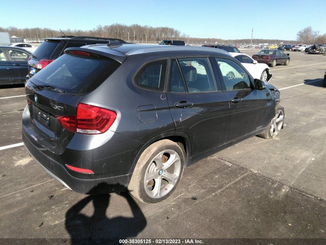 2014 BMW X1, VIN: WBAVM5C50EVV93302