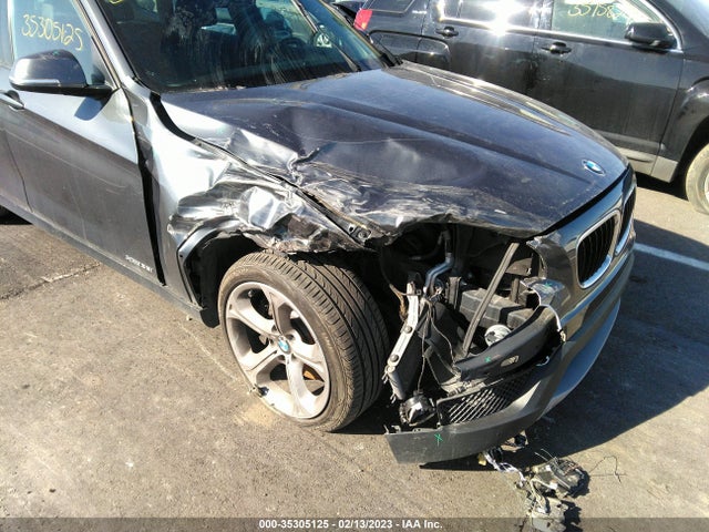 2014 BMW X1, VIN: WBAVM5C50EVV93302