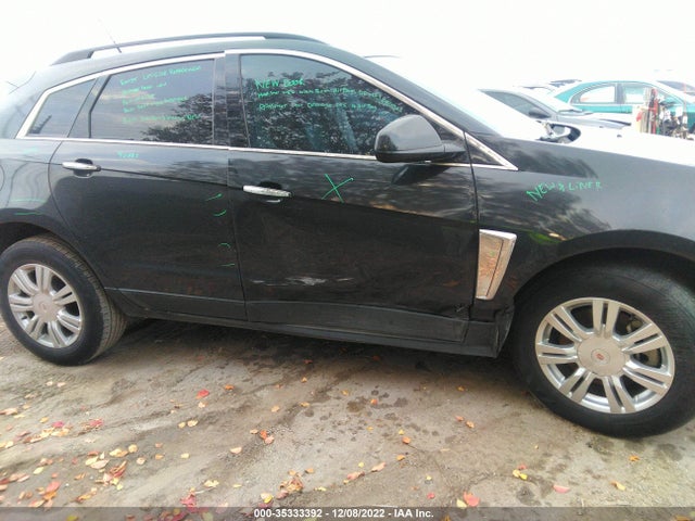 2014 Cadillac SRX, VIN: 3GYFNAE39ES565569