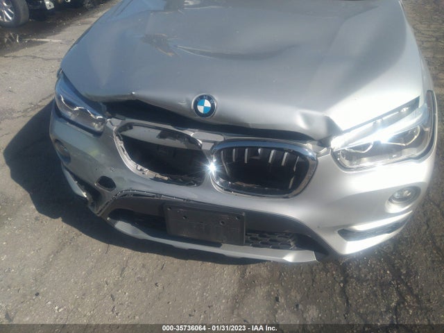 2018 BMW X1, VIN: WBXHU7C34J5L08026