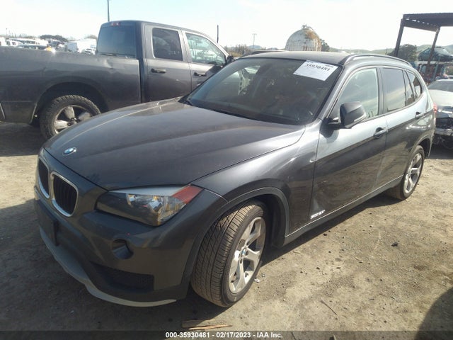 2015 BMW X1, VIN: WBAVM1C56FV318821