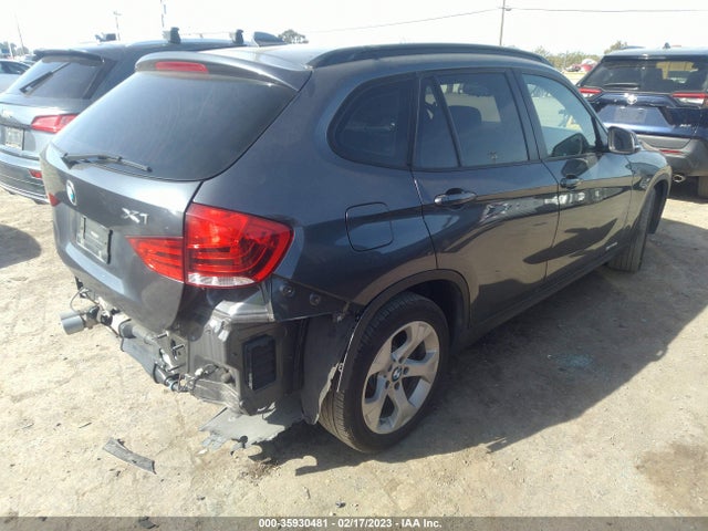 2015 BMW X1, VIN: WBAVM1C56FV318821