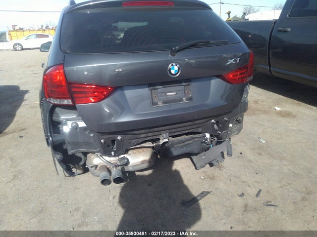 2015 BMW X1, VIN: WBAVM1C56FV318821