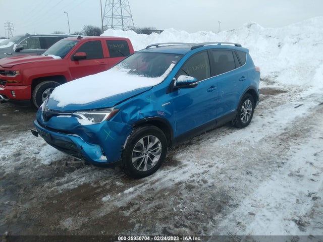2018 Toyota RAV4, VIN: JTMRJREV2JD211532