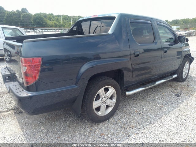 2010 HONDA RIDGELINE RTL VIN: 5FPYK1F50AB011385
