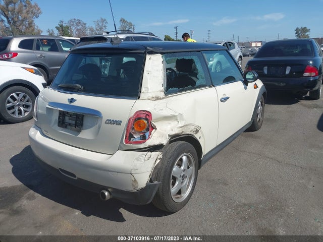 2010 MINI COOPER HARDTOP VIN: WMWMF3C56ATZ62082