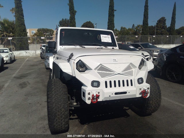 1C4HJWDG9EL235366 Jeep Wrangler Unlimited Sport