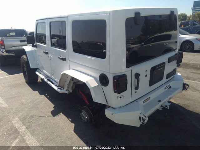 1C4HJWDG9EL235366 Jeep Wrangler Unlimited Sport