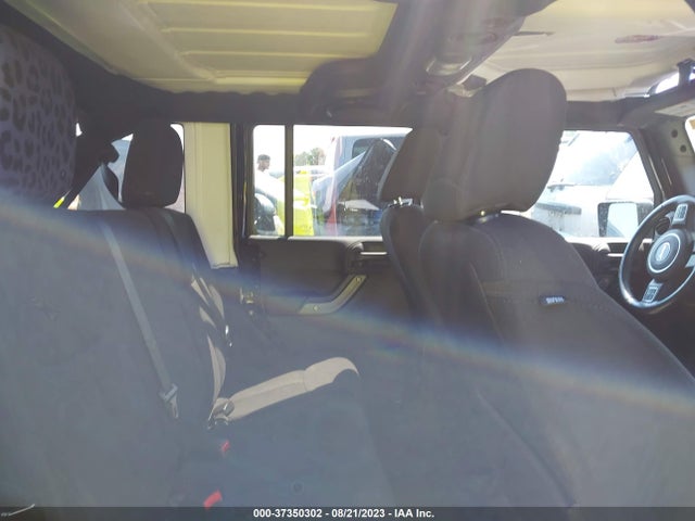 1C4HJWDG0EL130103 Jeep Wrangler Unlimited Sport