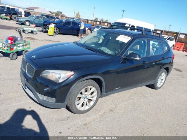 2014 BMW X1 WBAVL1C5XEVY24105 Photo 1