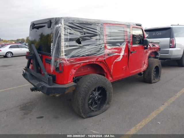 1C4BJWDG9EL102516 Jeep Wrangler Unlimited Sport