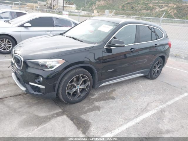 2016 BMW X1 WBXHT3C32G5E51550 Photo 1