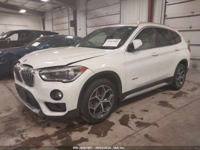 2017 BMW X1 WBXHT3C31H5F76458 Photo 1
