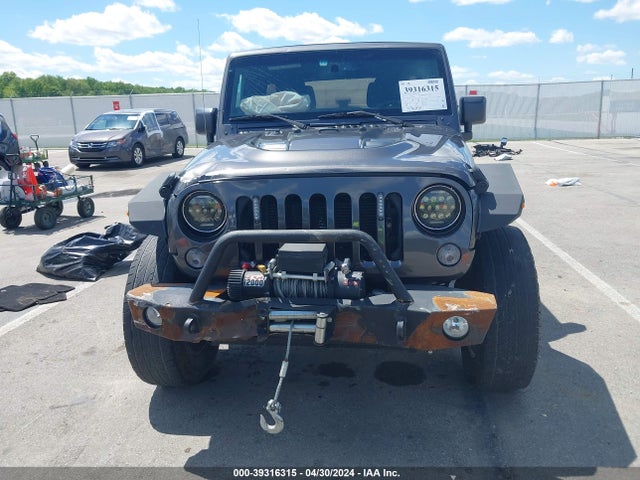 1C4BJWDG8EL298898 Jeep Wrangler Unlimited Sport