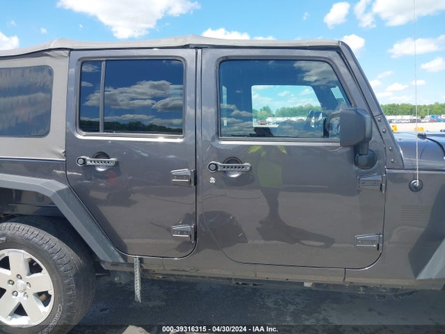 1C4BJWDG8EL298898 Jeep Wrangler Unlimited Sport