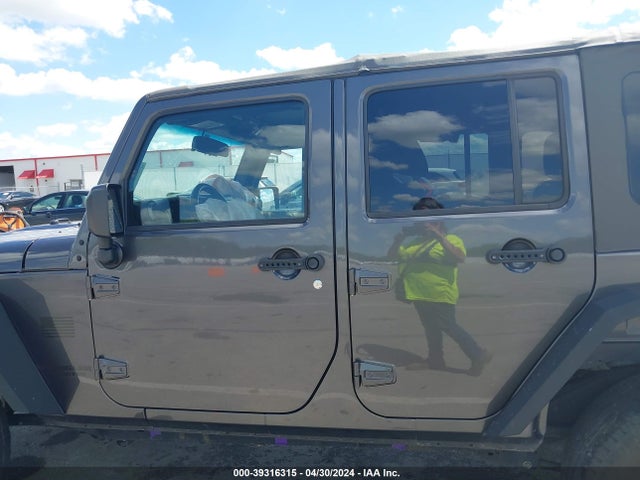 1C4BJWDG8EL298898 Jeep Wrangler Unlimited Sport