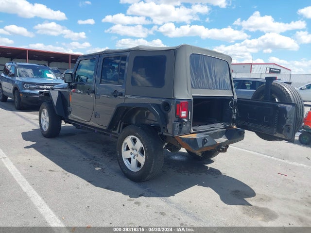 1C4BJWDG8EL298898 Jeep Wrangler Unlimited Sport