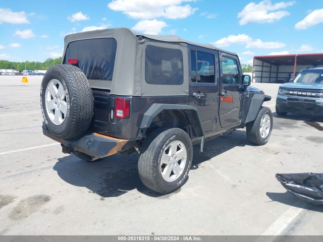 1C4BJWDG8EL298898 Jeep Wrangler Unlimited Sport