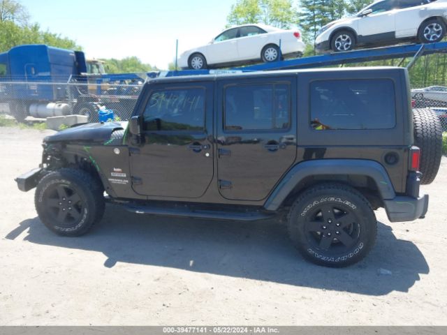 1C4BJWDG9EL309584 Jeep Wrangler Unlimited Sport