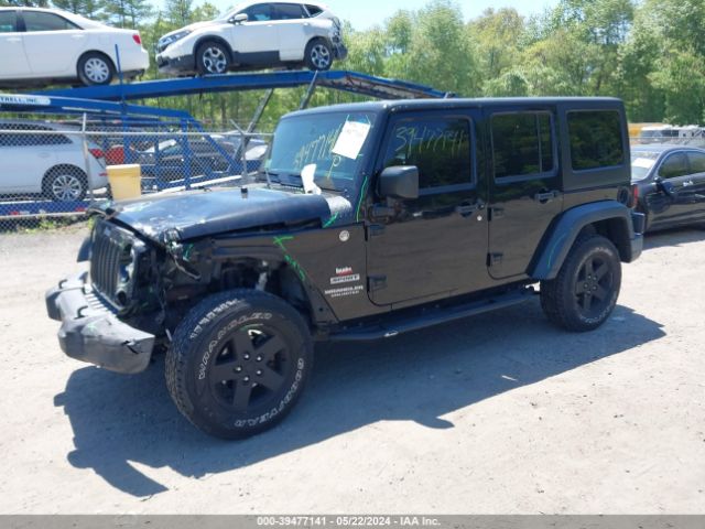 1C4BJWDG9EL309584 Jeep Wrangler Unlimited Sport