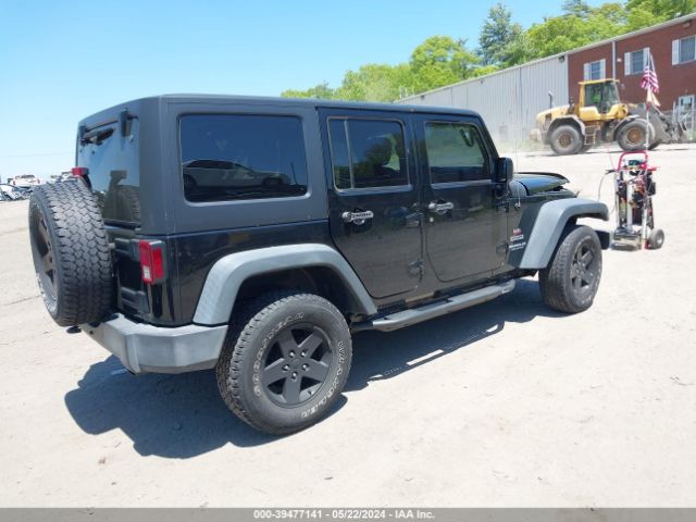 1C4BJWDG9EL309584 Jeep Wrangler Unlimited Sport