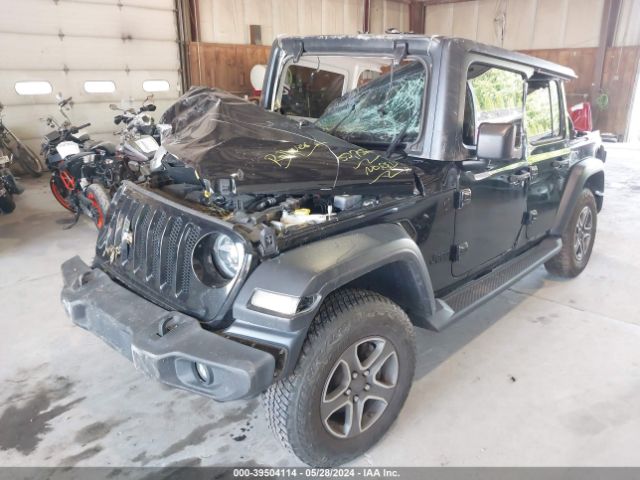 1C4HJXDG0LW257953 Jeep Wrangler Unlimited Black And Tan 4x4