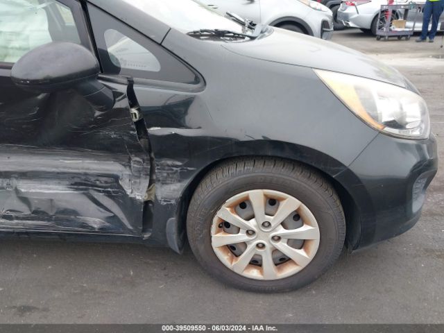 KNADM5A3XE6409586 KIA RIO LX
