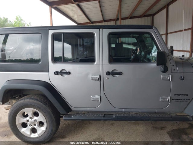 1C4BJWDG7EL130668 Jeep Wrangler Unlimited Sport