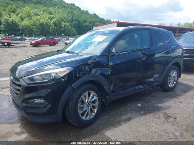 KM8J3CA46GU023537 Hyundai TUCSON SE