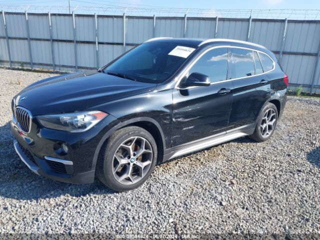 2018 BMW X1 WBXHT3C35J5L24828 Photo 1