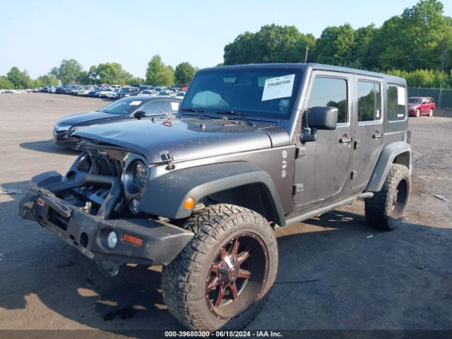 1C4BJWDG8EL180379 Jeep Wrangler Unlimited Sport
