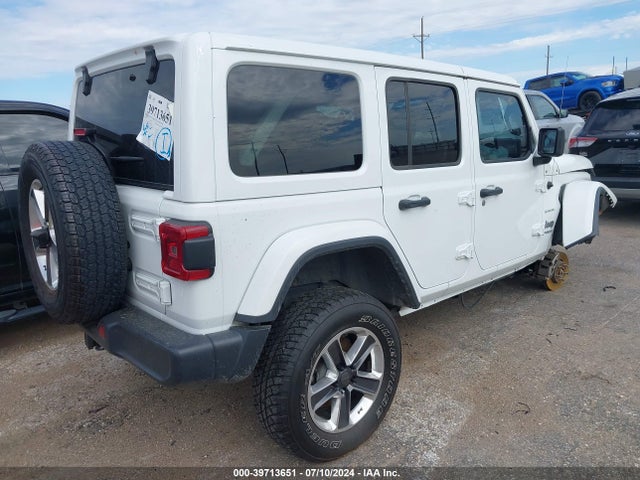 1C4HJXEG4JW135950 Jeep Wrangler Unlimited Sahara 4x4