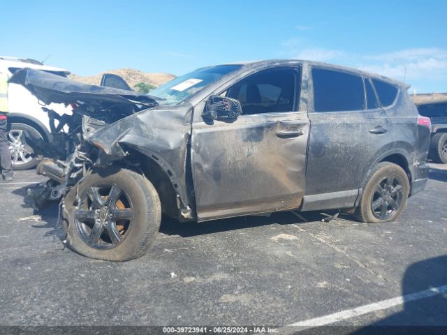 JTMZFREV9JJ173185 Toyota RAV4 LE