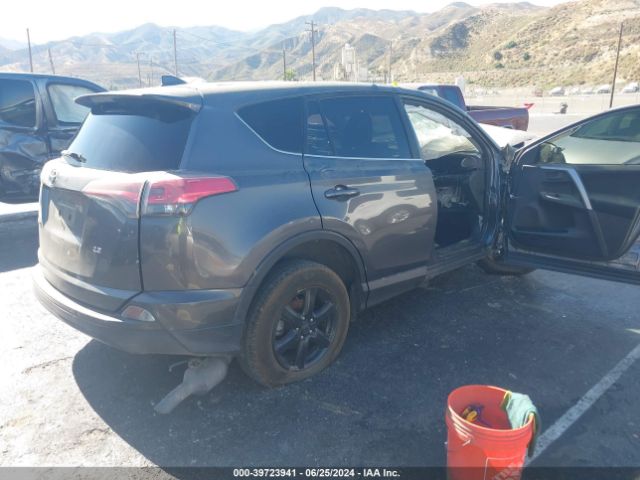 JTMZFREV9JJ173185 Toyota RAV4 LE