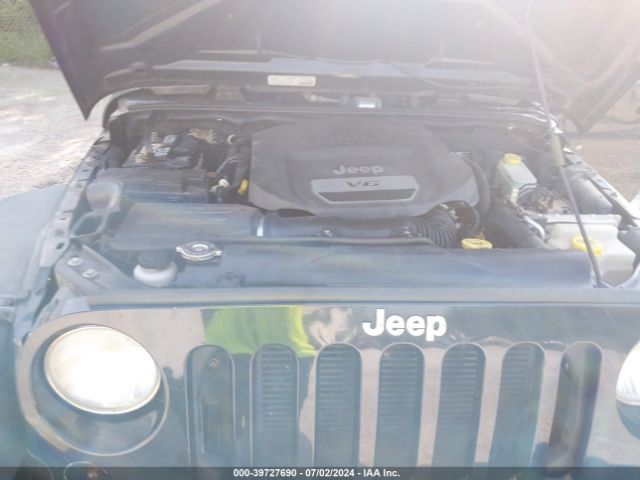 1C4HJWDG2EL195521 Jeep Wrangler Unlimited Sport
