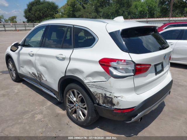 2017 BMW X1 WBXHT3C33H5F87302 Photo 2