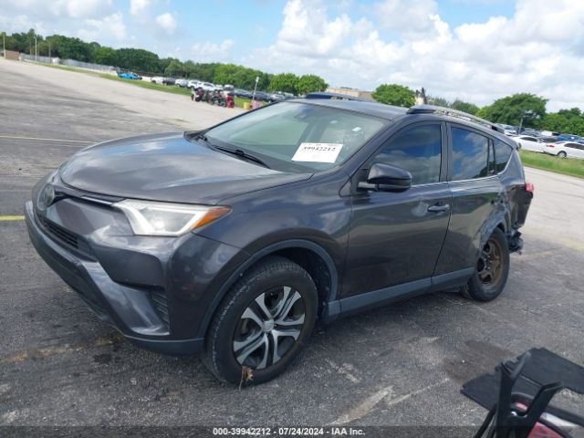 JTMZFREVXJJ189380 Toyota RAV4 LE