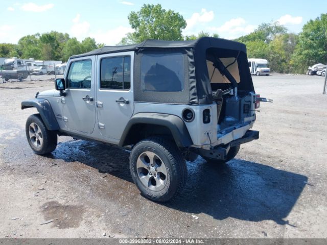 1C4BJWDG9EL116111 Jeep Wrangler Unlimited Sport