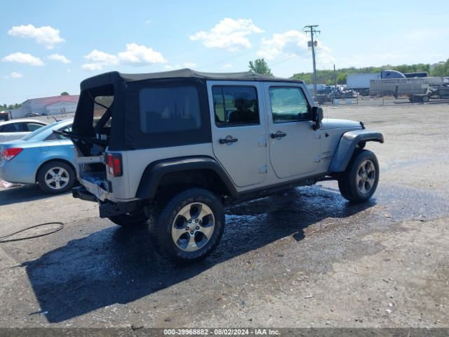 1C4BJWDG9EL116111 Jeep Wrangler Unlimited Sport